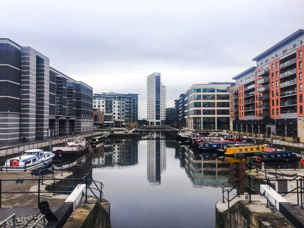 high rise buildings with body of water